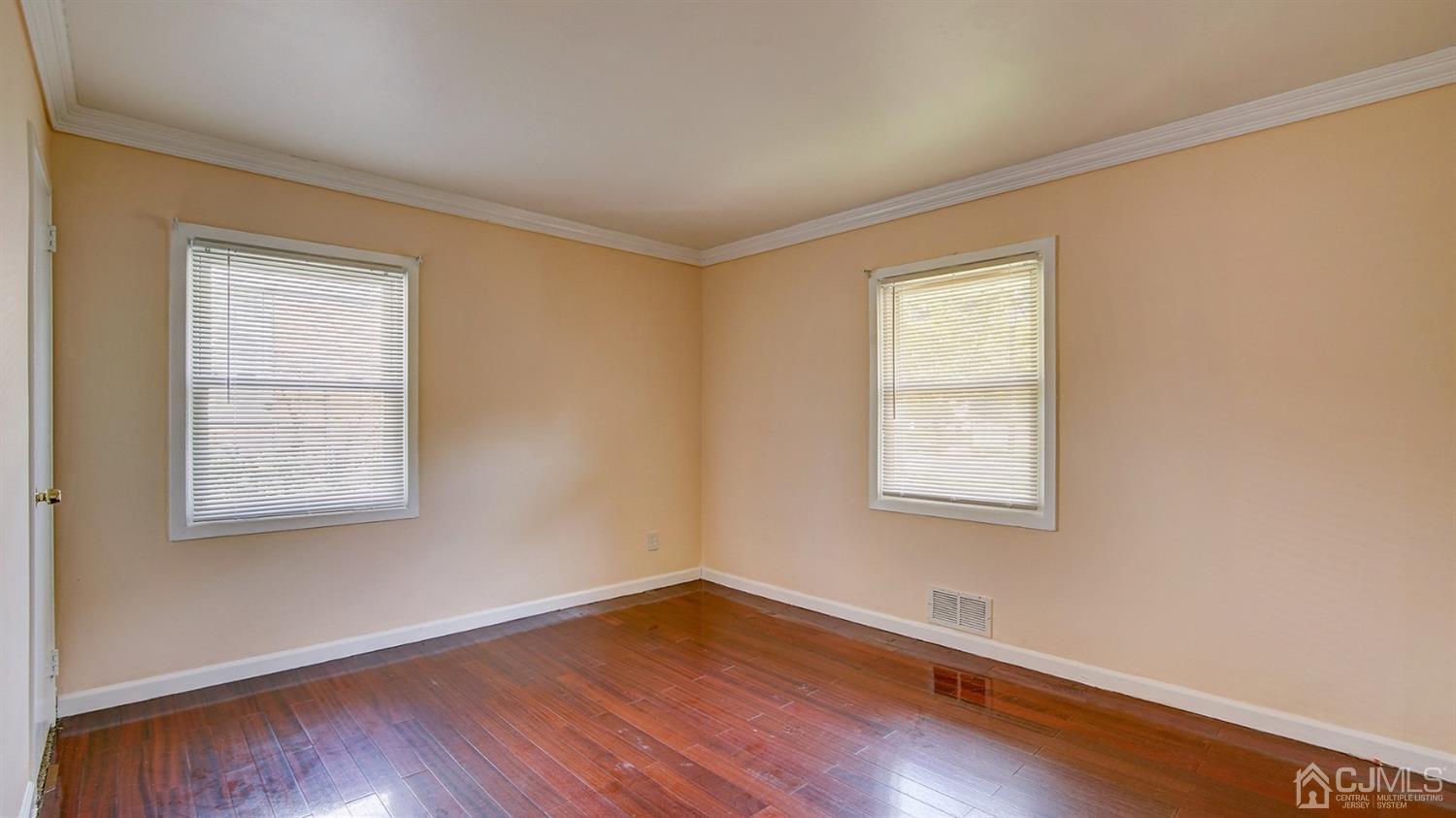 10 Melville Road Edison, NJ 08817 - Photo 14 of 32 an empty room with wooden floor and windows