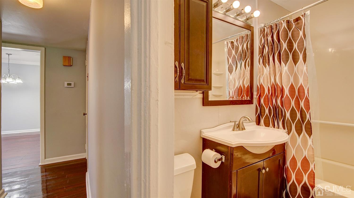 10 Melville Road Edison, NJ 08817 - Photo 16 of 32 a bathroom with a sink and a mirror