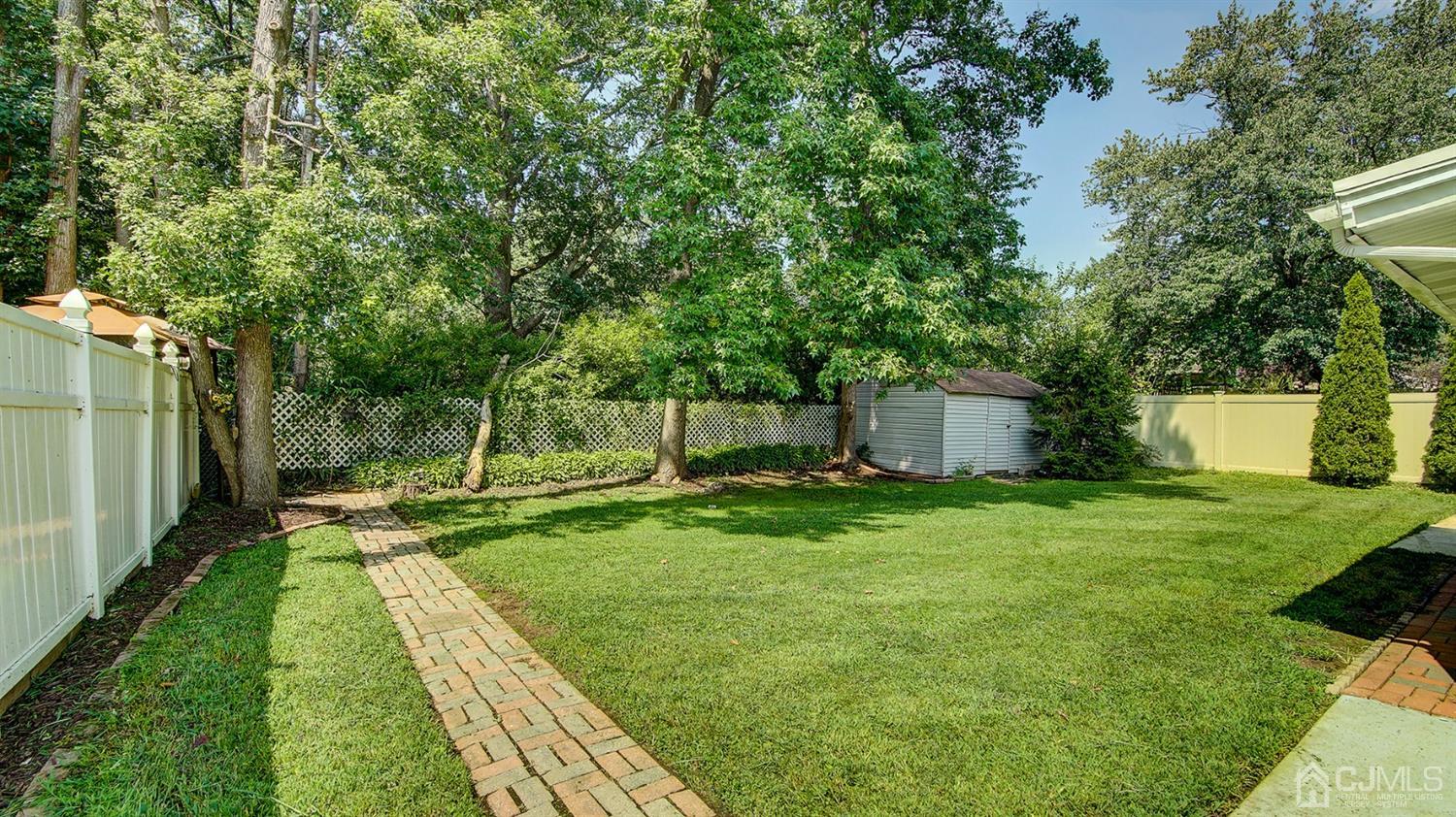 10 Melville Road Edison, NJ 08817 - Photo 29 of 32 a view of a backyard with a garden
