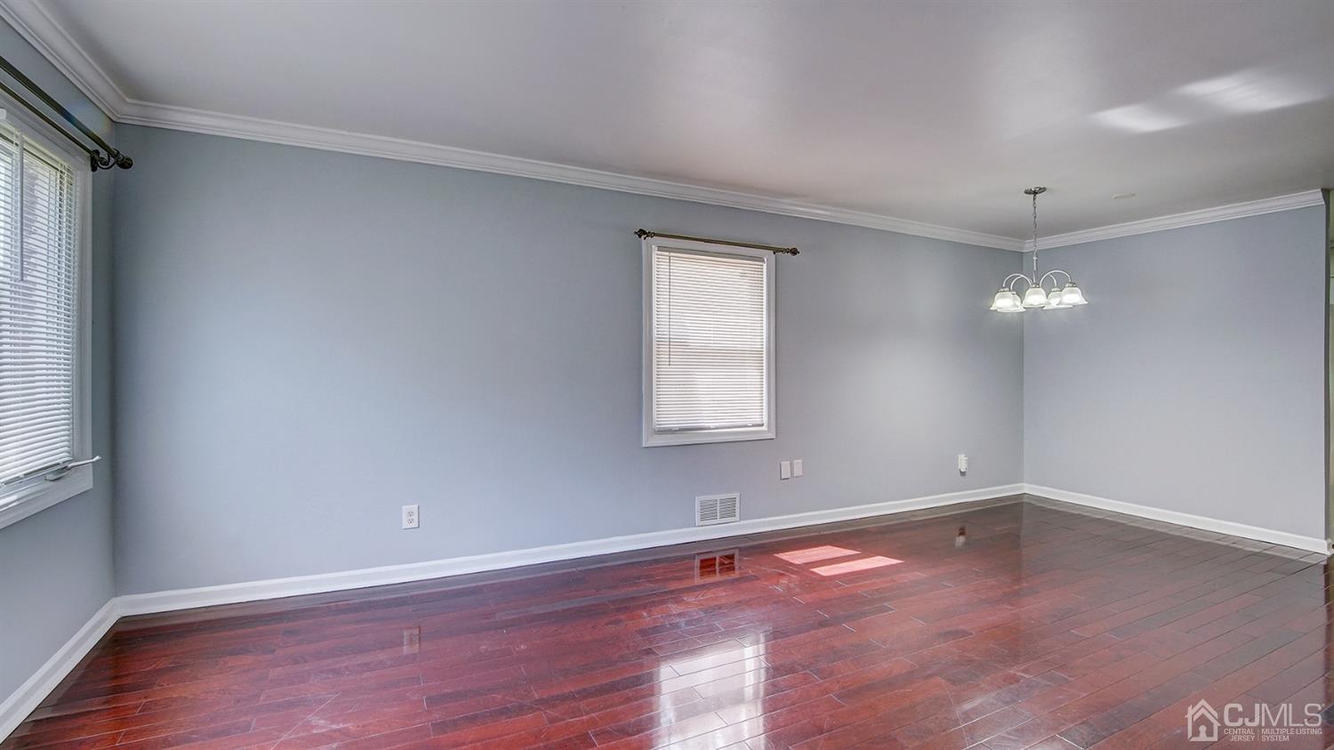 10 Melville Road Edison, NJ 08817 - Photo 4 of 32 wooden floor in an empty room with a window