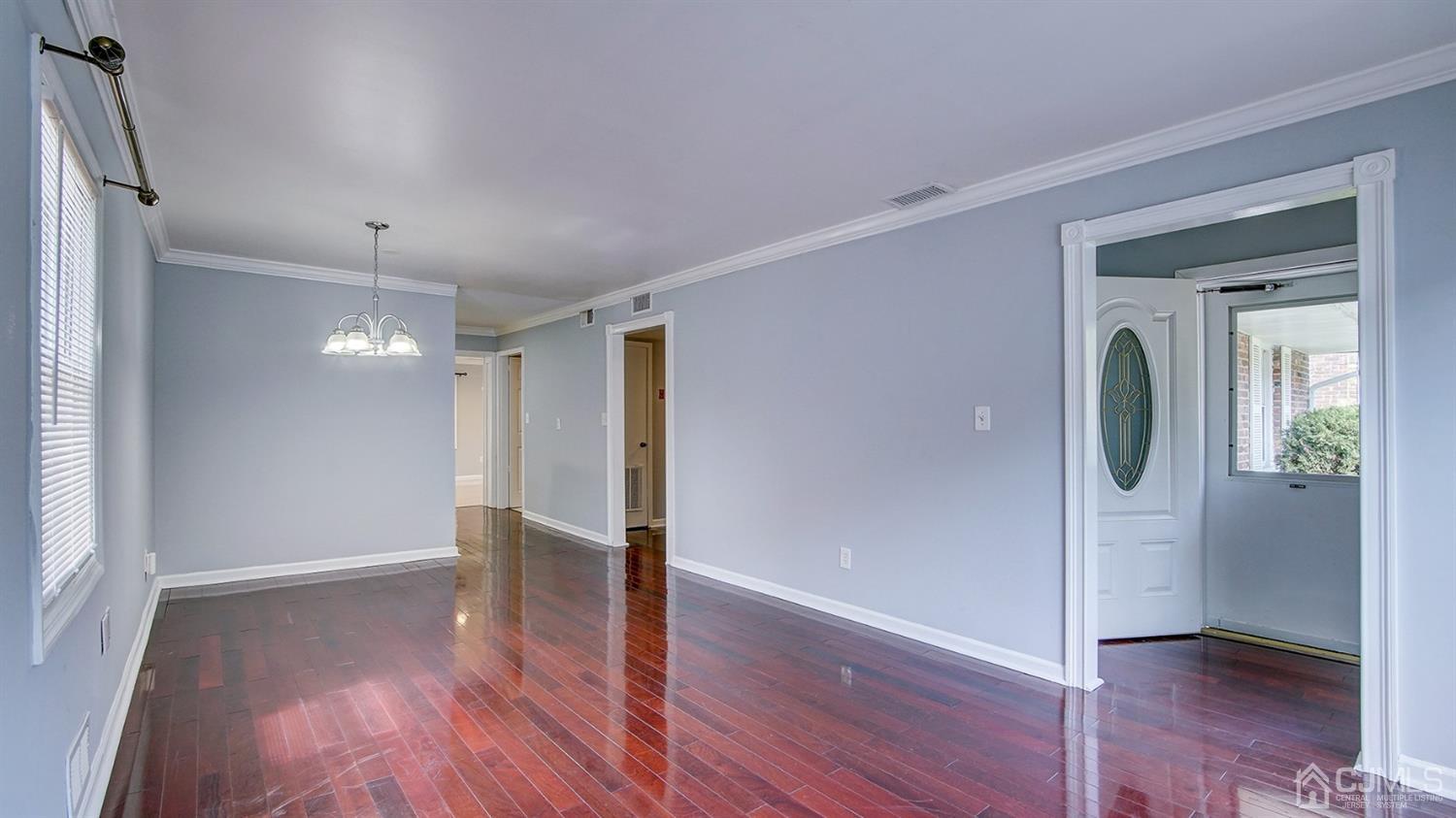 10 Melville Road Edison, NJ 08817 - Photo 6 of 32 wooden floor in an empty room with a window