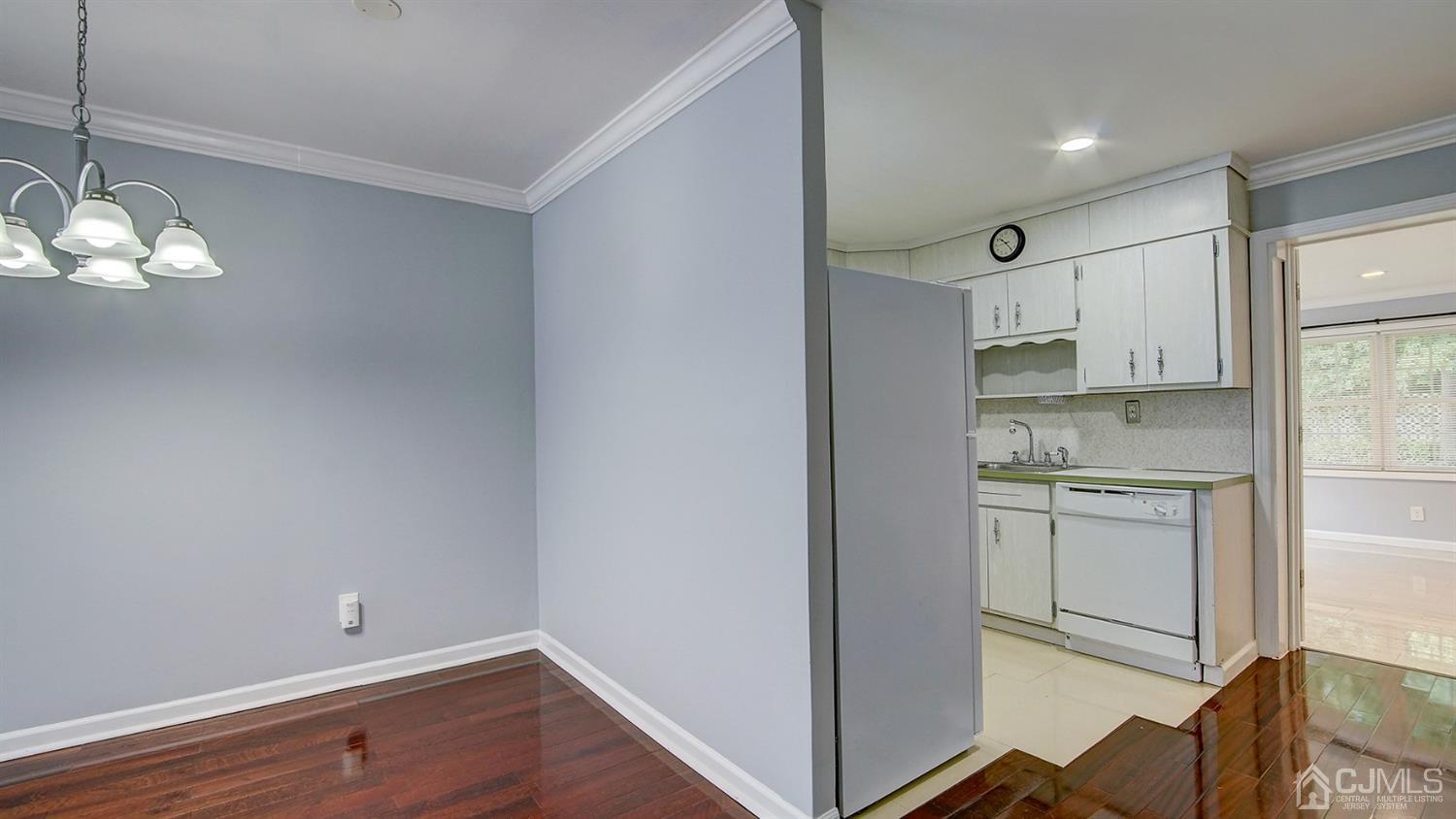 10 Melville Road Edison, NJ 08817 - Photo 9 of 32 a room with stainless steel appliances white cabinets and wooden floor