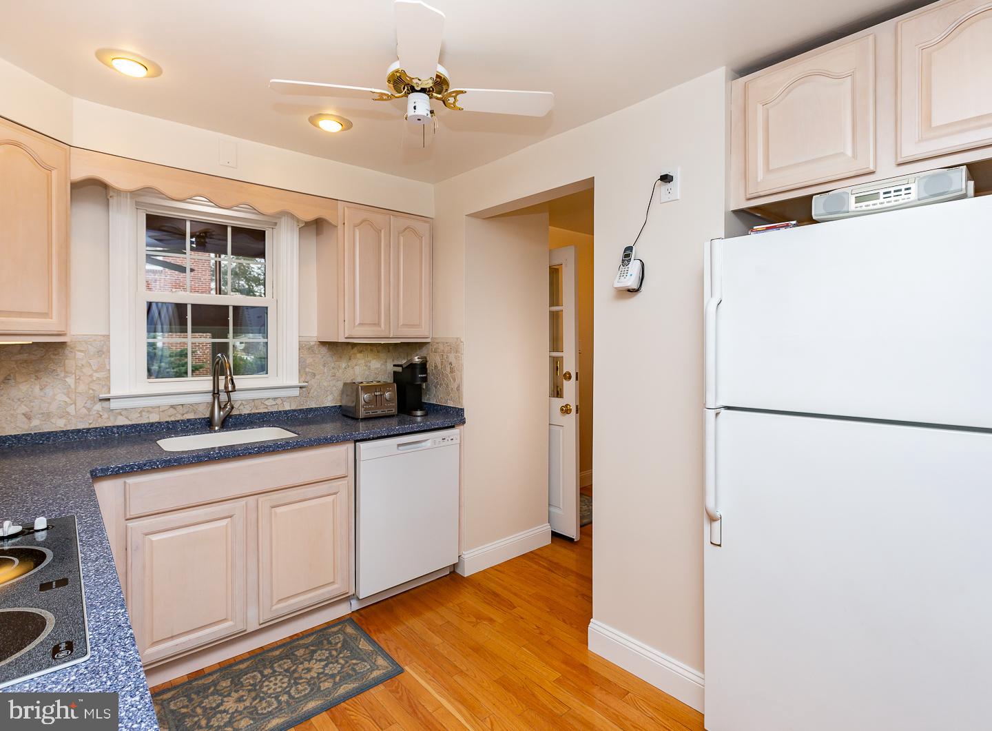 2717 Prescott Road Havertown, PA 19083 - Photo 13 of 49 a kitchen with a refrigerator a sink and cabinets