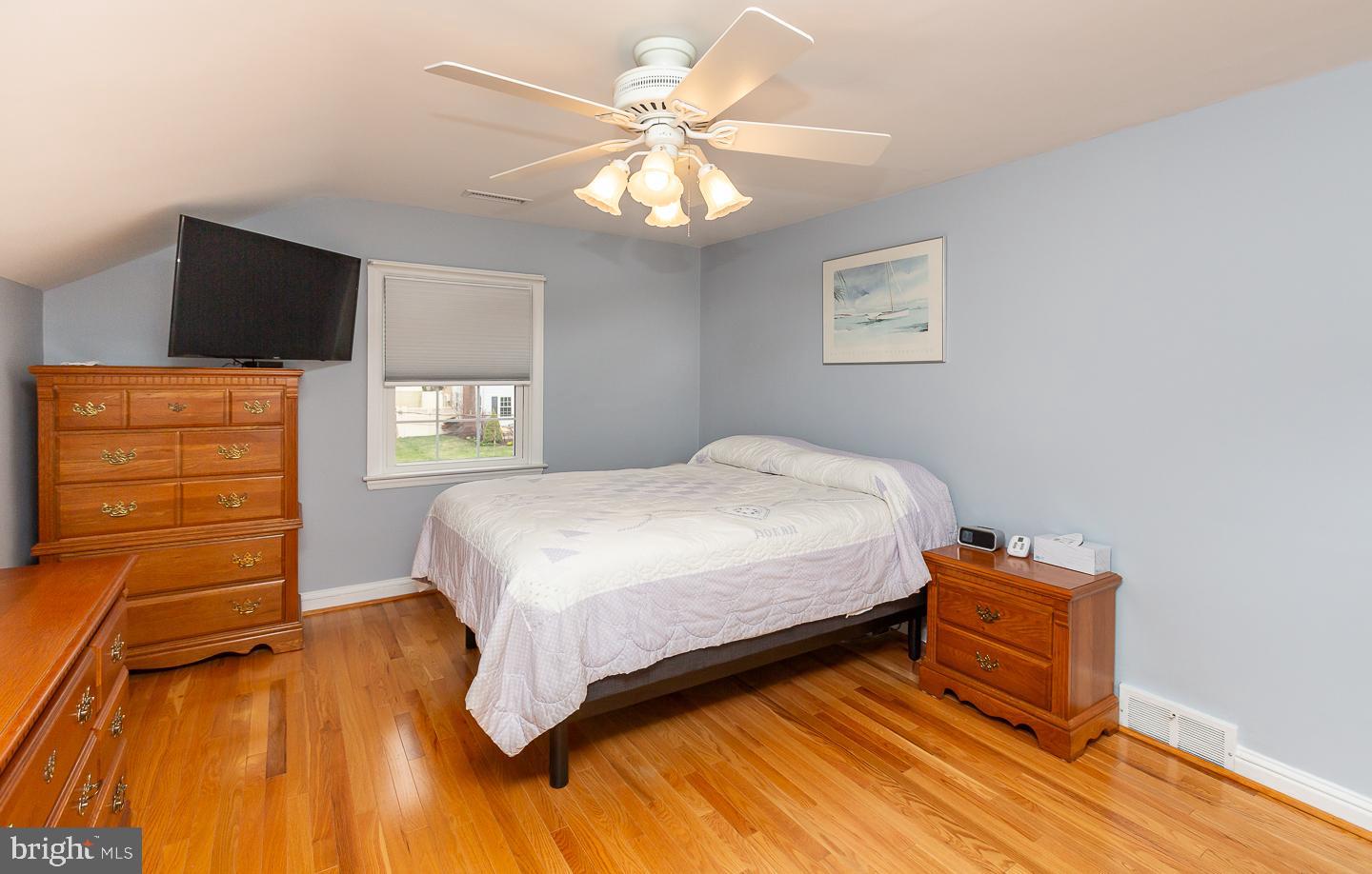 2717 Prescott Road Havertown, PA 19083 - Photo 28 of 49 a bedroom with a bed and wooden floor