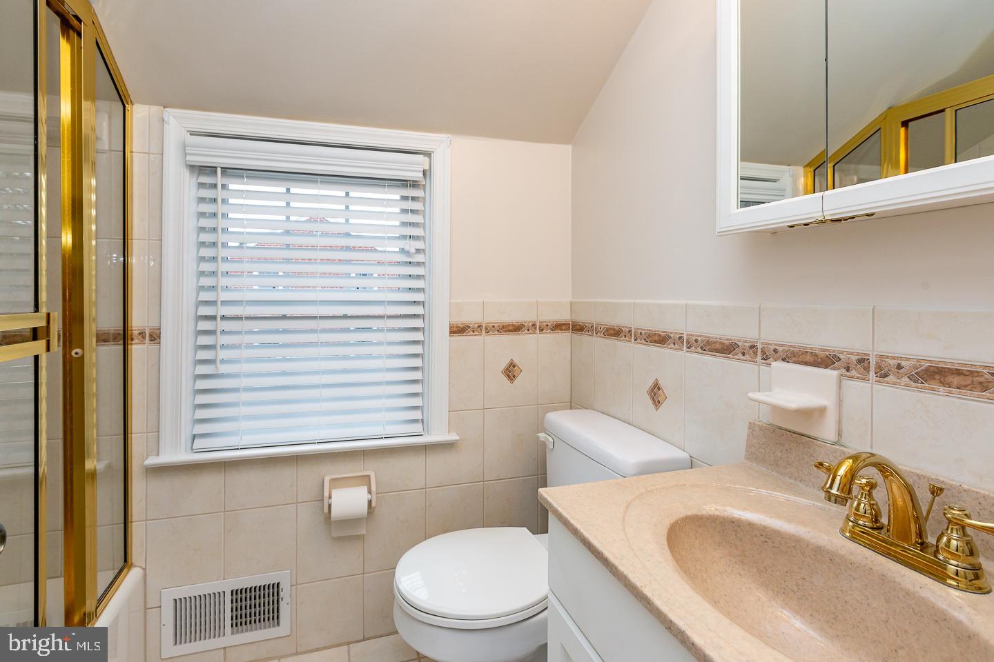 2717 Prescott Road Havertown, PA 19083 - Photo 34 of 49 a white toilet sitting next to a bathroom sink