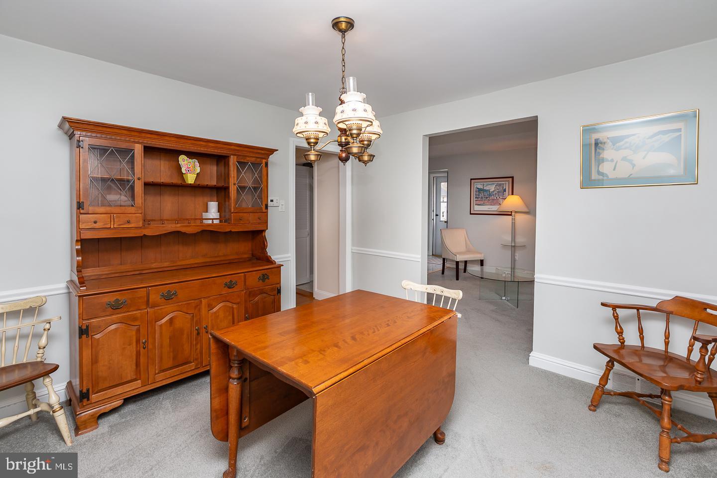 2717 Prescott Road Havertown, PA 19083 - Photo 10 of 49 a living room with furniture a dining table and a chandelier