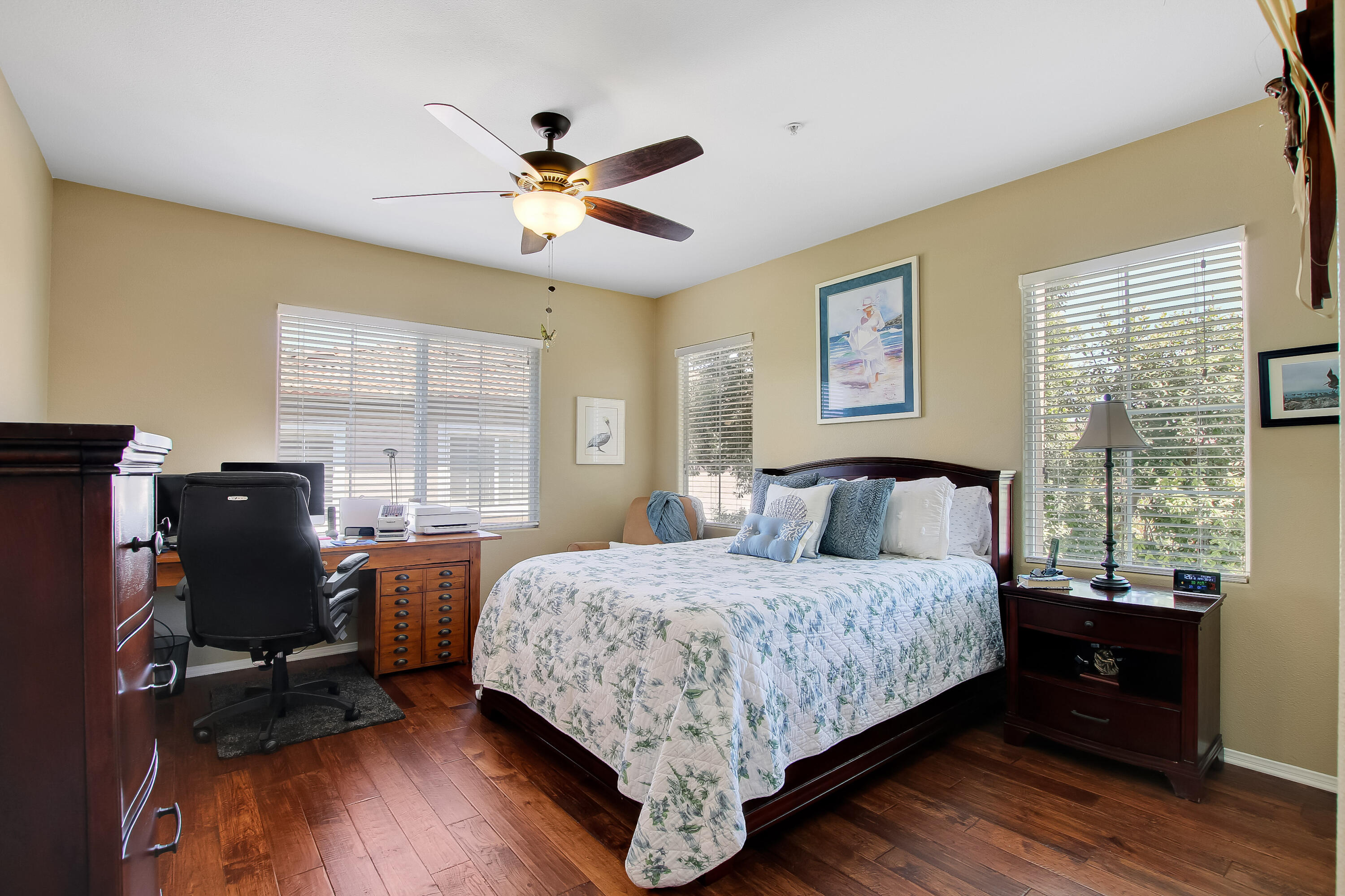 586 Poppyfield Place Goleta, CA 93117 - Photo 17 of 37 a bedroom with a bed and wooden floor