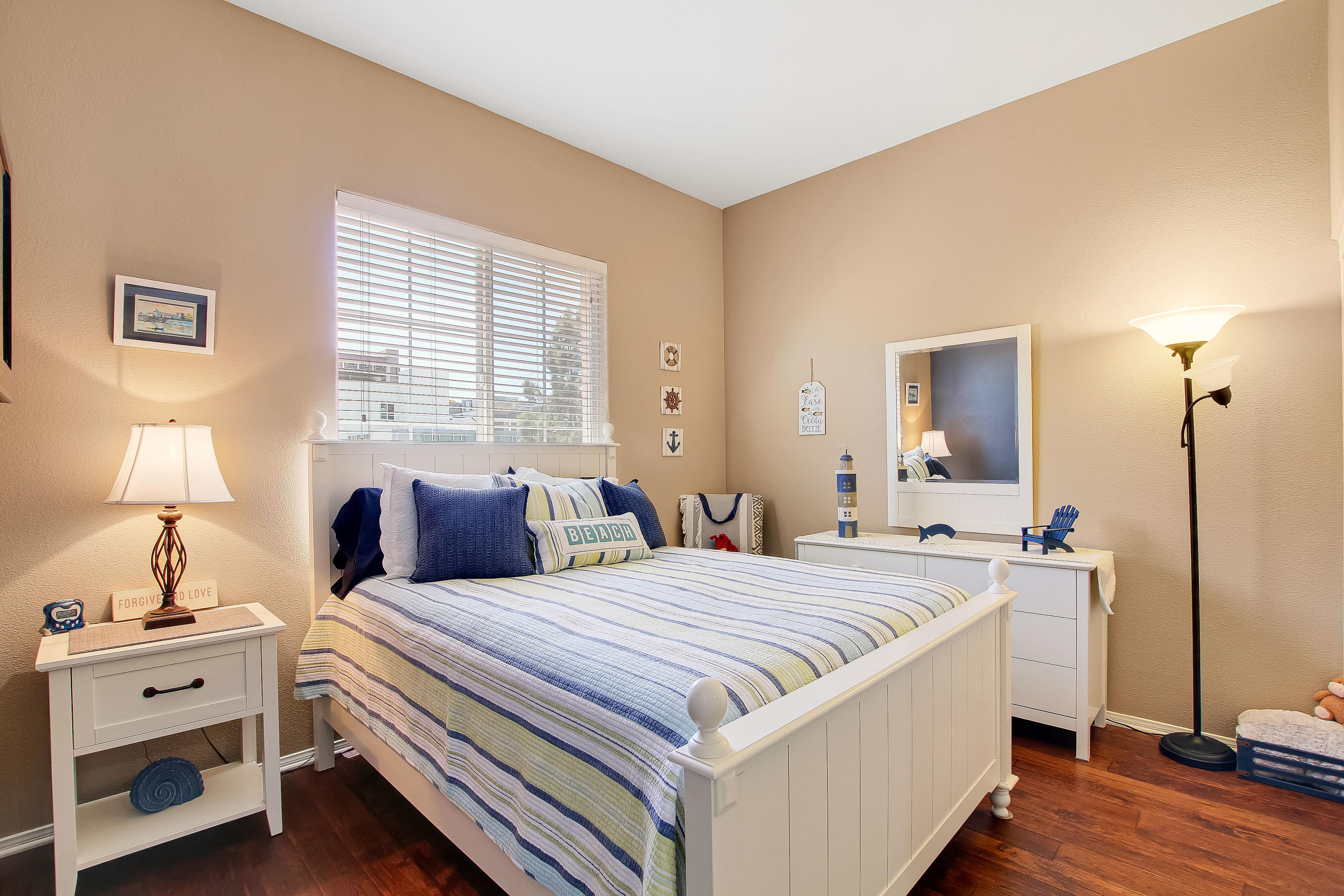 586 Poppyfield Place Goleta, CA 93117 - Photo 21 of 37 a bedroom with a bed and a chandelier