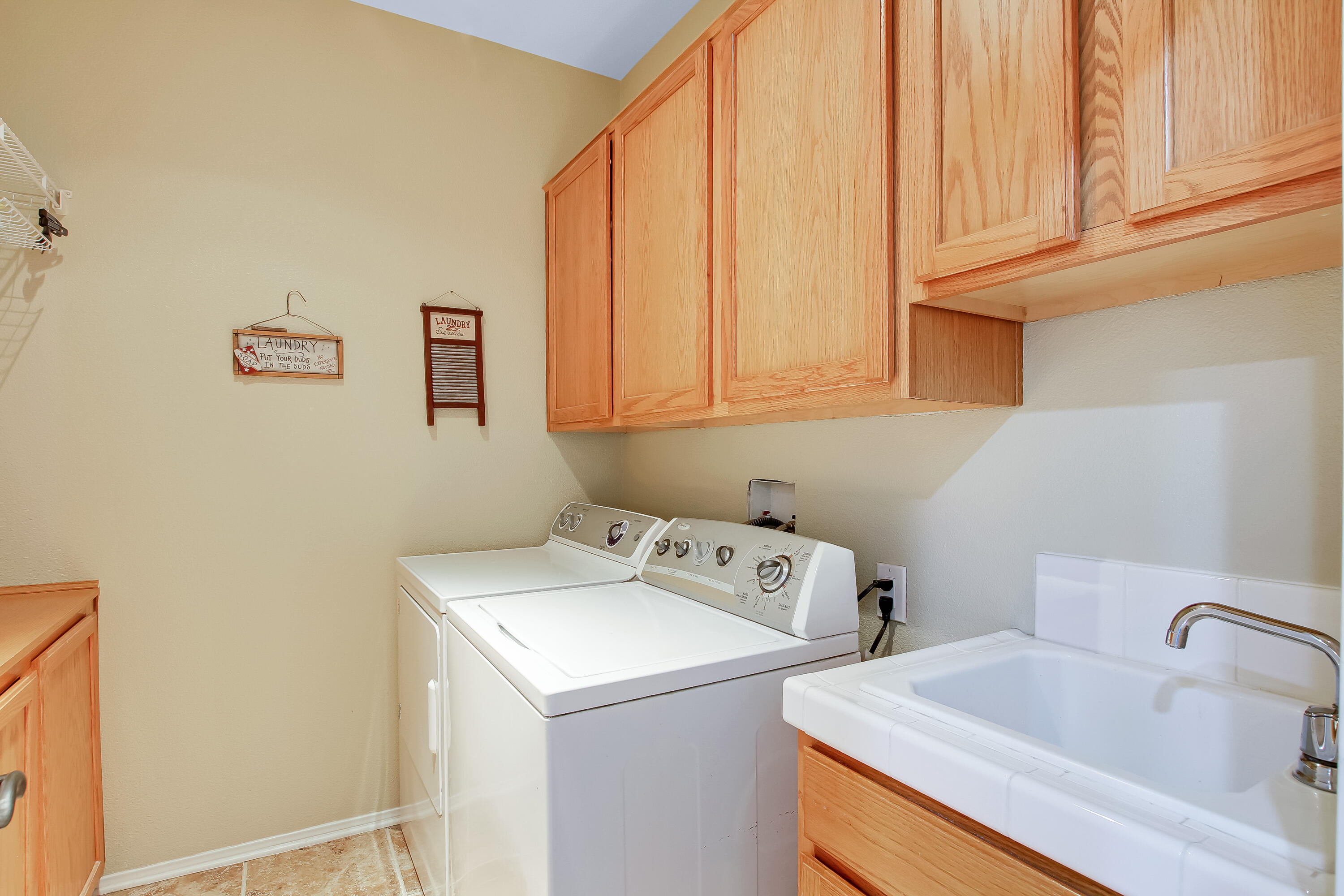 586 Poppyfield Place Goleta, CA 93117 - Photo 24 of 37 a utility room with dryer and washer