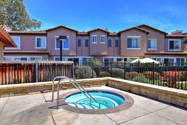 a view of a house with swimming pool and porch