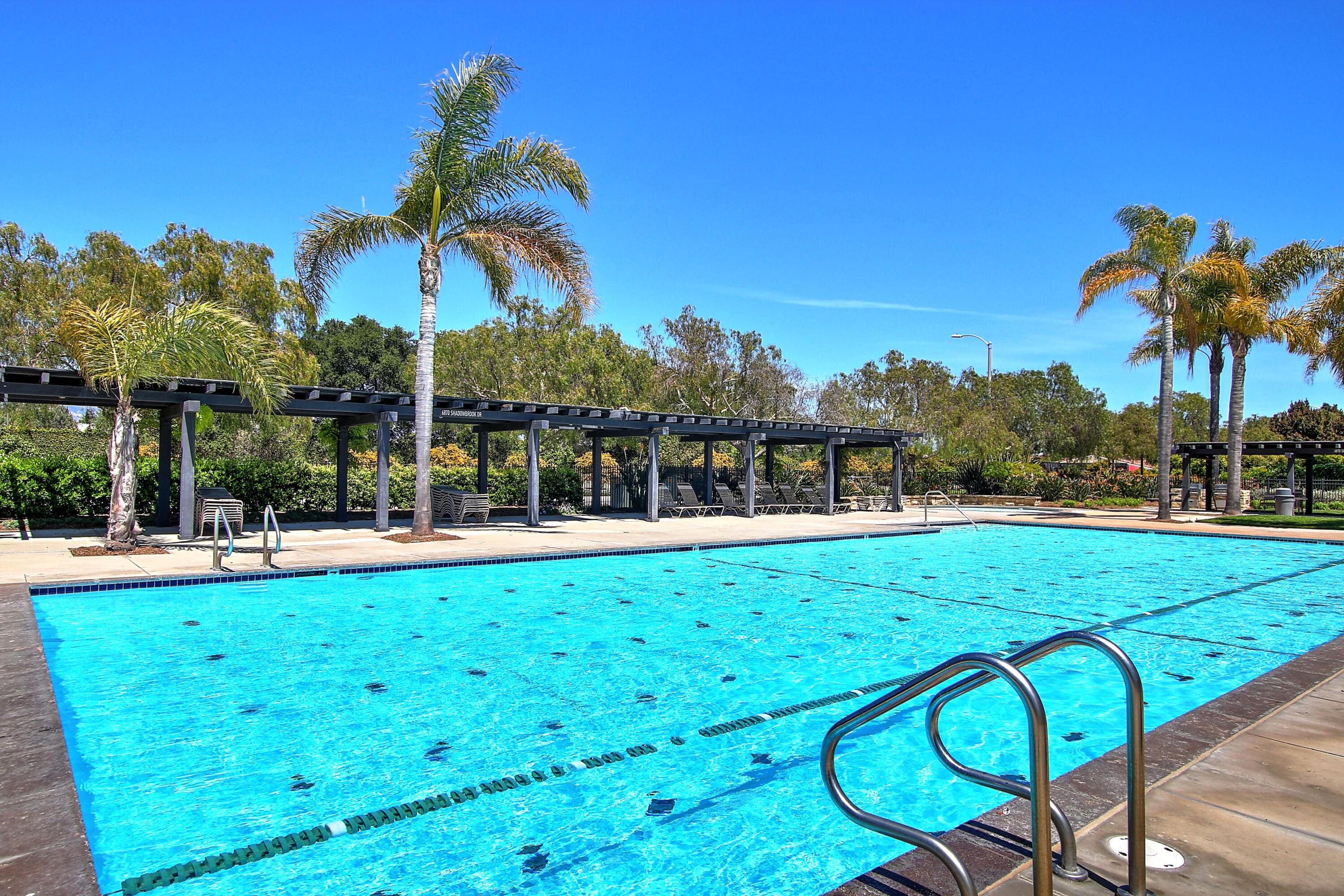 586 Poppyfield Place Goleta, CA 93117 - Photo 31 of 37 a view of a swimming pool with a table and chairs