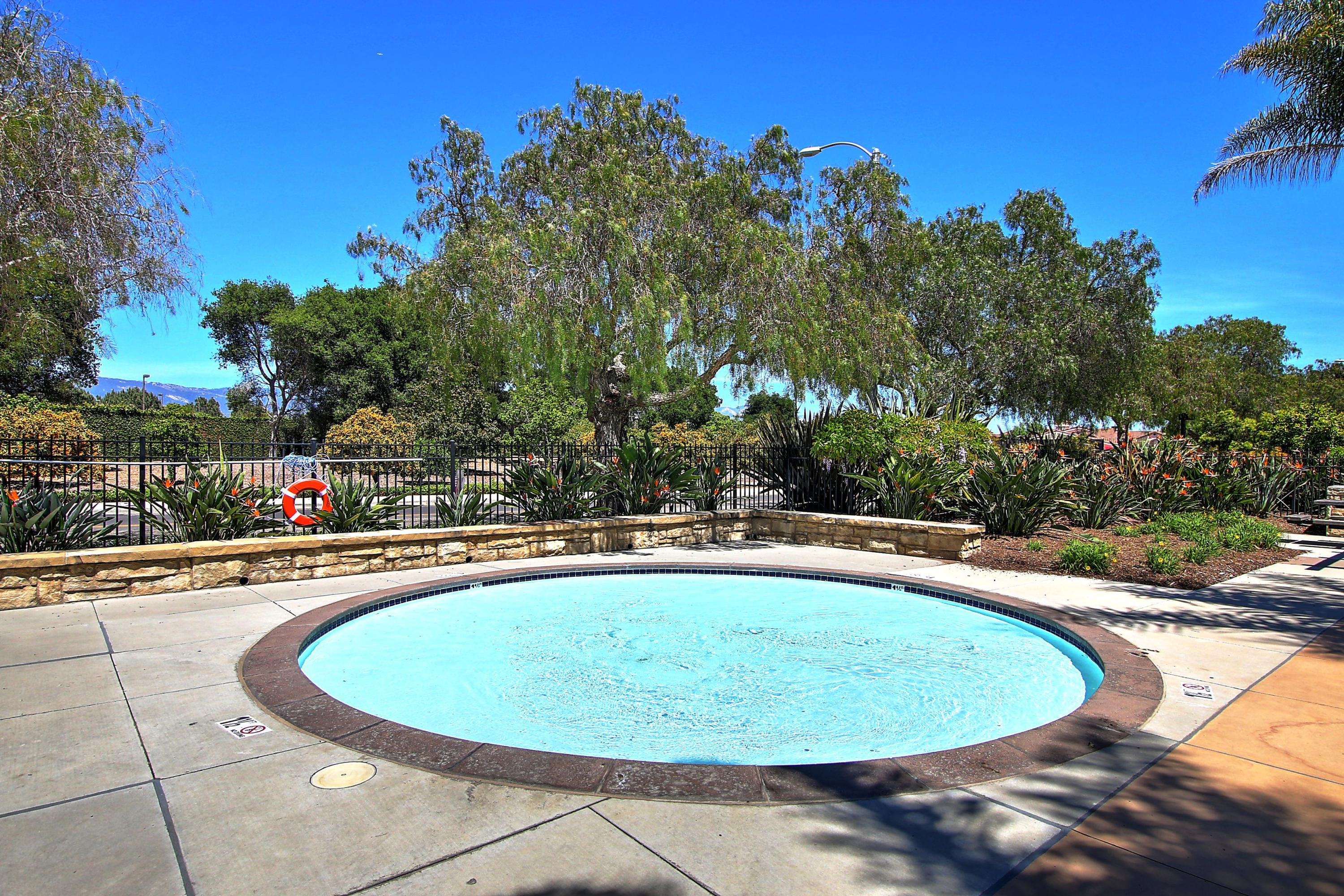 586 Poppyfield Place Goleta, CA 93117 - Photo 32 of 37 a view of a swimming pool with an outdoor seating