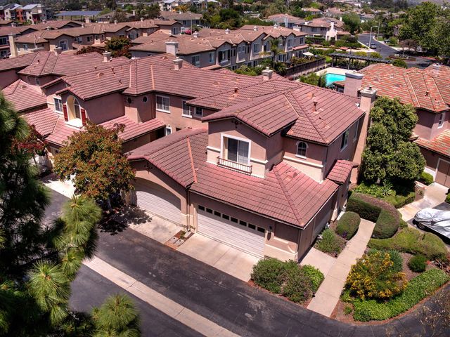an aerial view of a house with a garden