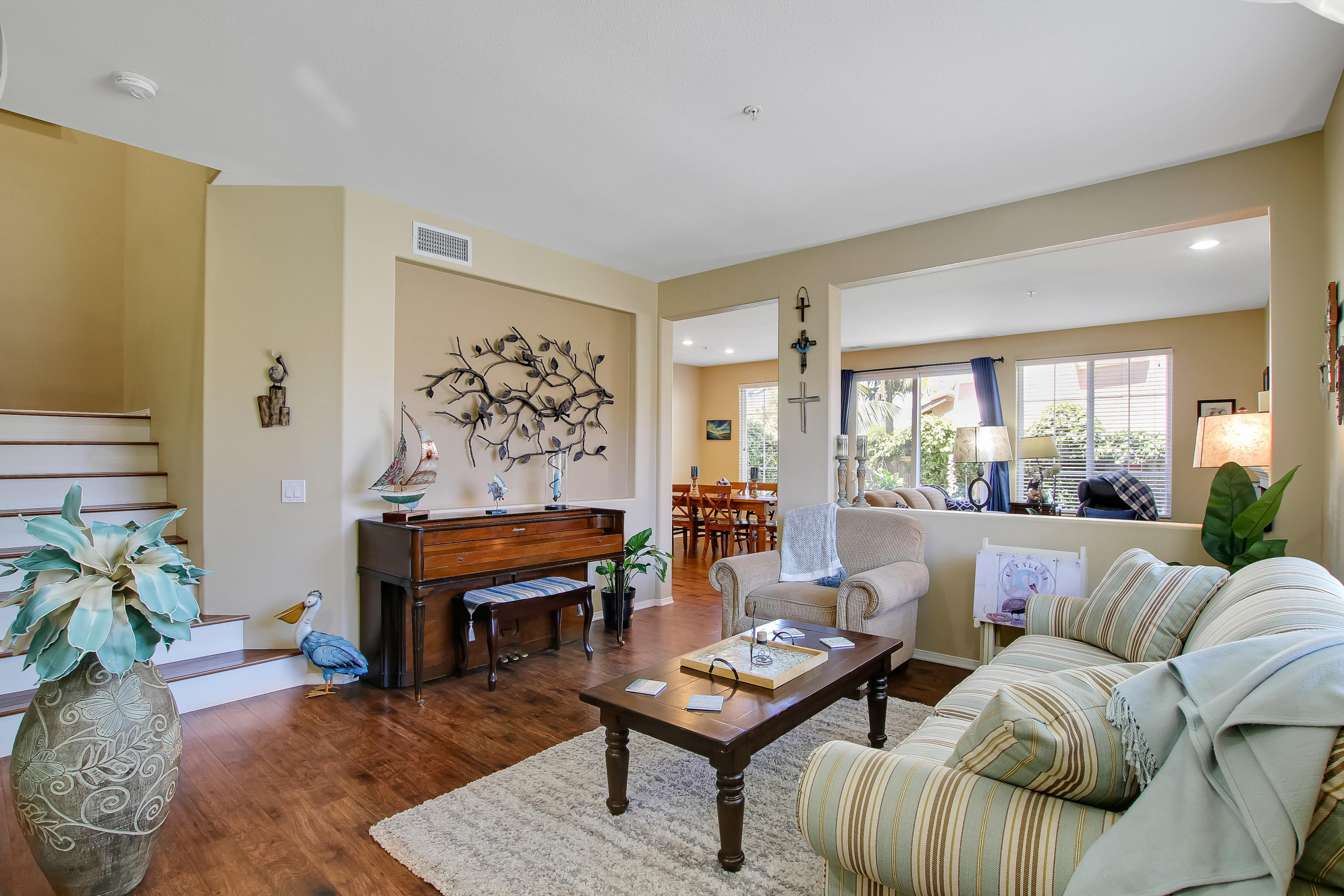 586 Poppyfield Place Goleta, CA 93117 - Photo 5 of 37 a living room with furniture coffee table and a potted plant