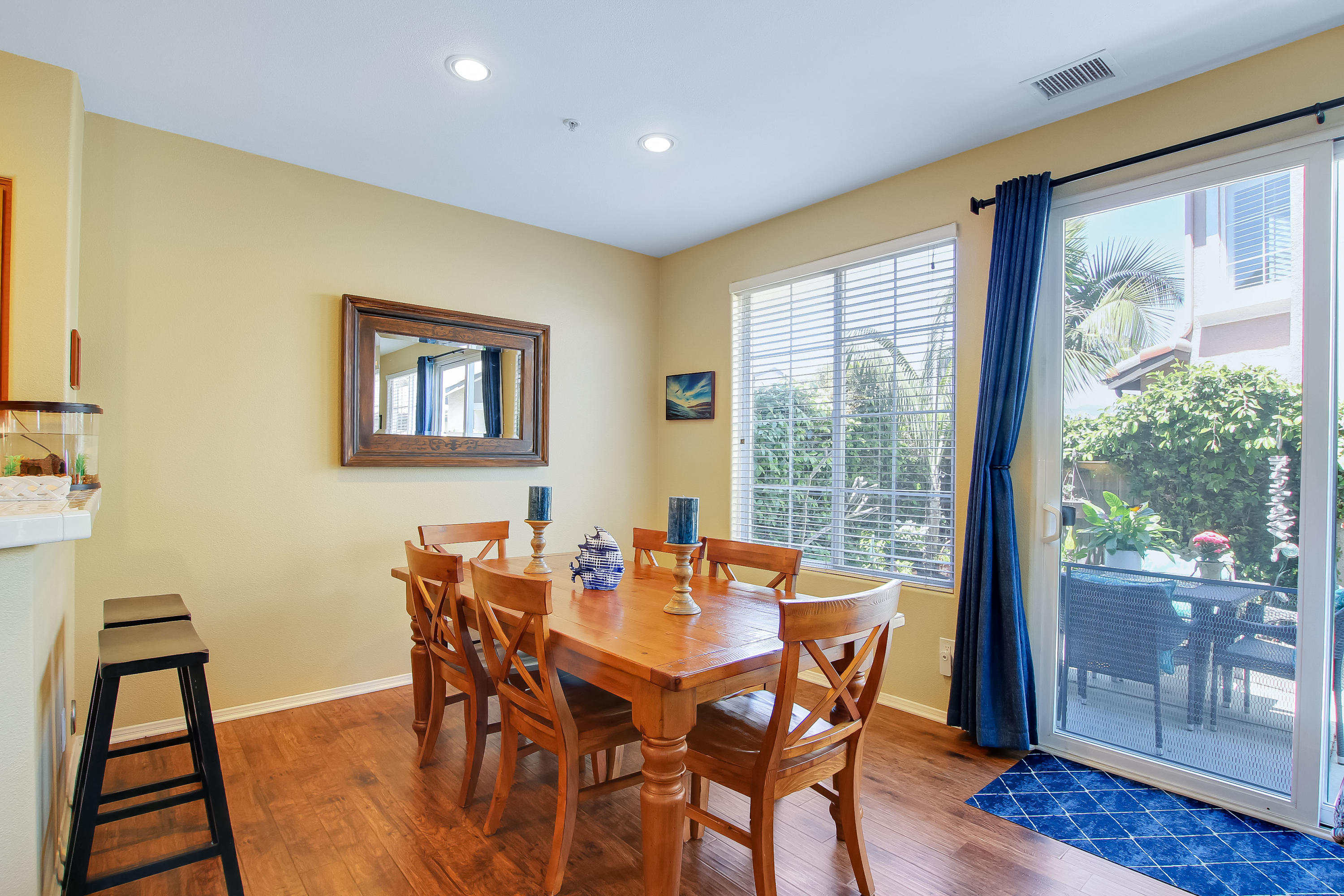 586 Poppyfield Place Goleta, CA 93117 - Photo 10 of 37 a view of a dining room with furniture and wooden floor