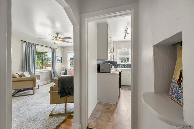 a view of a backyard with a garden and entertaining space