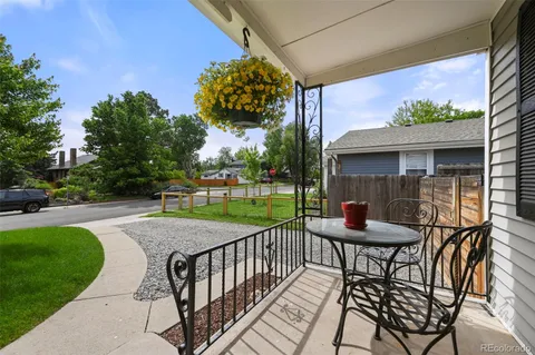 a view of a table and chairs in patio of the house
