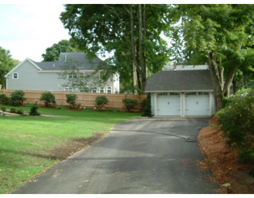 7 Dee Road Lexington, MA 02420 - Photo 3 of 12 a front view of a house with a yard garage and outdoor seating