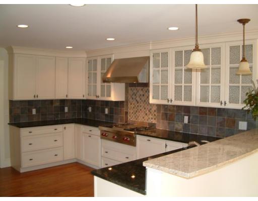 7 Dee Road Lexington, MA 02420 - Photo 6 of 12 a kitchen with granite countertop a sink a stove and cabinets