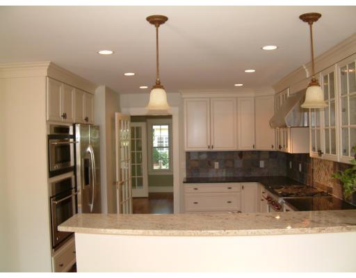 7 Dee Road Lexington, MA 02420 - Photo 7 of 12 a view of a kitchen with a sink and a counter top space