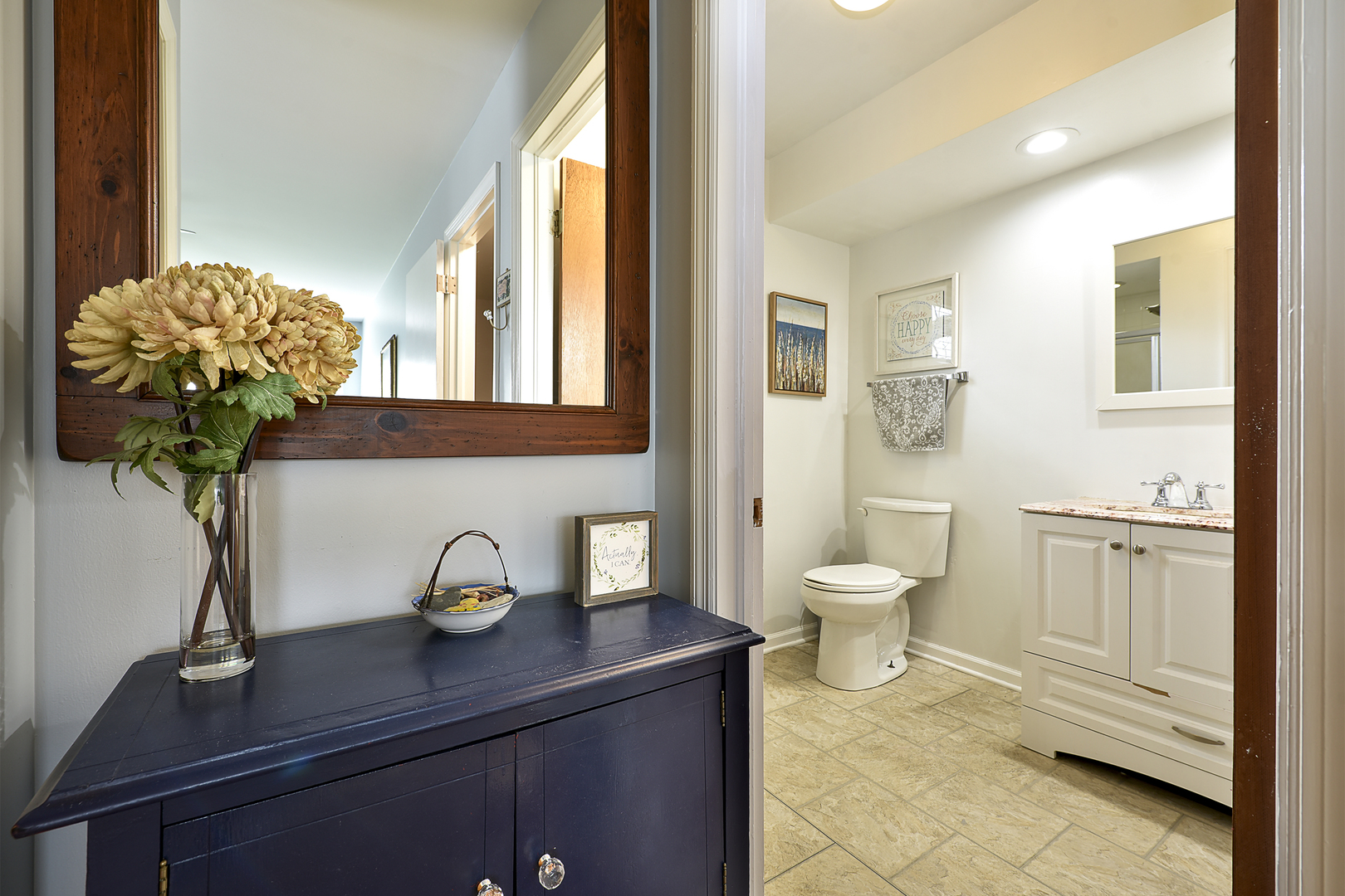 317 Roberts Road Inverness, IL 60067 - Photo 12 of 20 a bathroom with a toilet a sink and a mirror