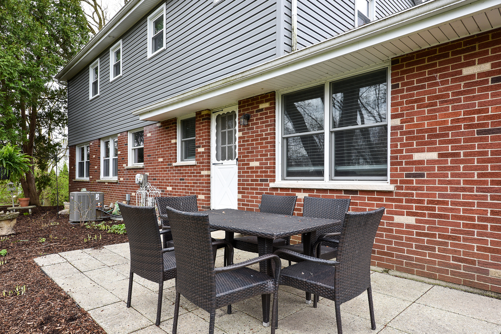 317 Roberts Road Inverness, IL 60067 - Photo 19 of 20 a view of a patio with table and chairs and potted plants
