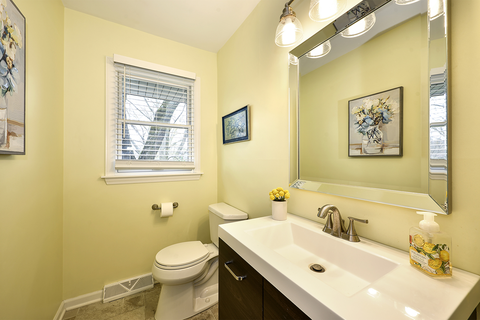 317 Roberts Road Inverness, IL 60067 - Photo 9 of 20 a bathroom with a sink and mirror with toilet