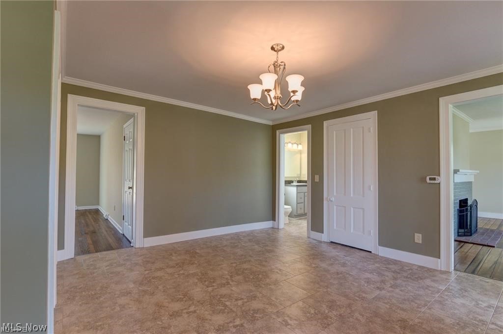15201 Trask Road Thompson, OH 44086 - Photo 21 of 28 Huge entry way - right off the front of the home with access to kitchen, family room, bathroom, and living room...hub of the home - use at a formal dining room - play room - living room - use one of the living rooms/family rooms as a dining room - your choice - very versatile home!