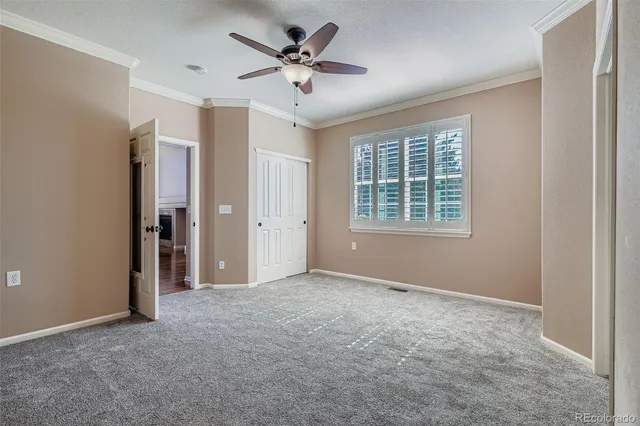 a bedroom with a bed and a chair