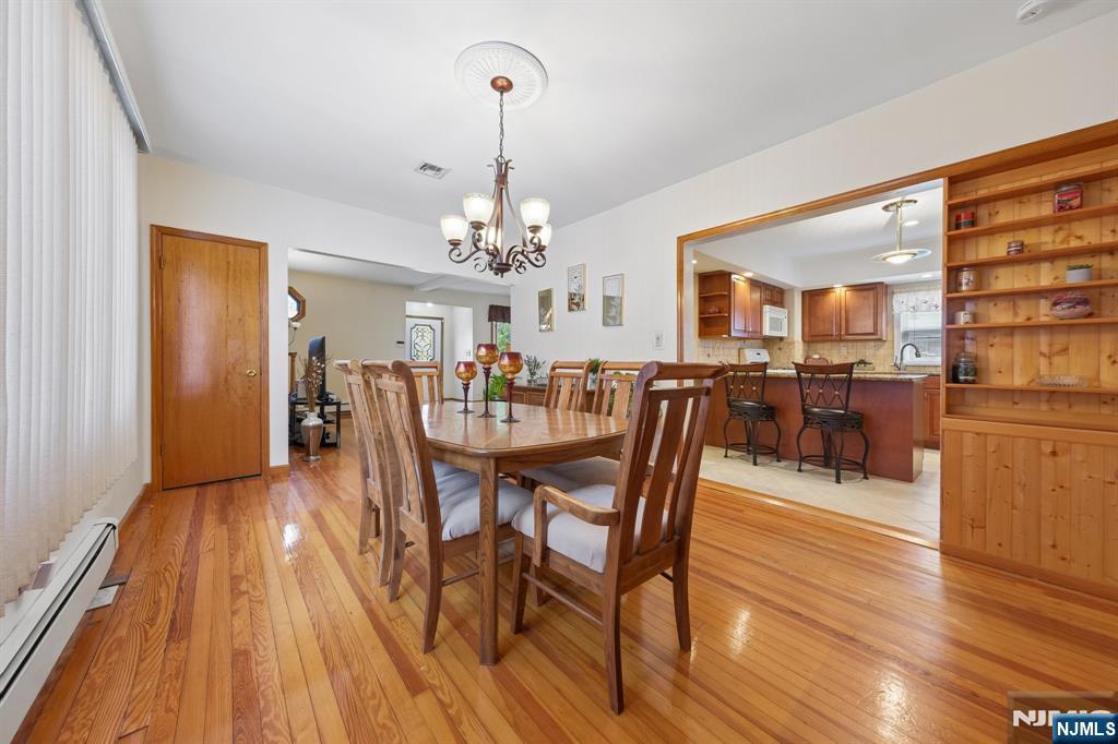 562 Valley Road Clifton, NJ 07013 - Photo 14 of 35 a view of a dining room with furniture and wooden floor