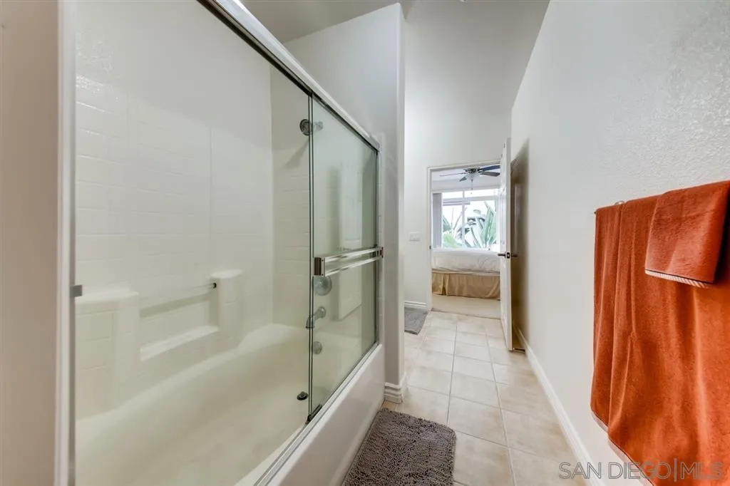 9263 Regents Road, Unit B203 La Jolla, CA 92037 - Photo 17 of 25 a bathroom with a bathtub and a shower