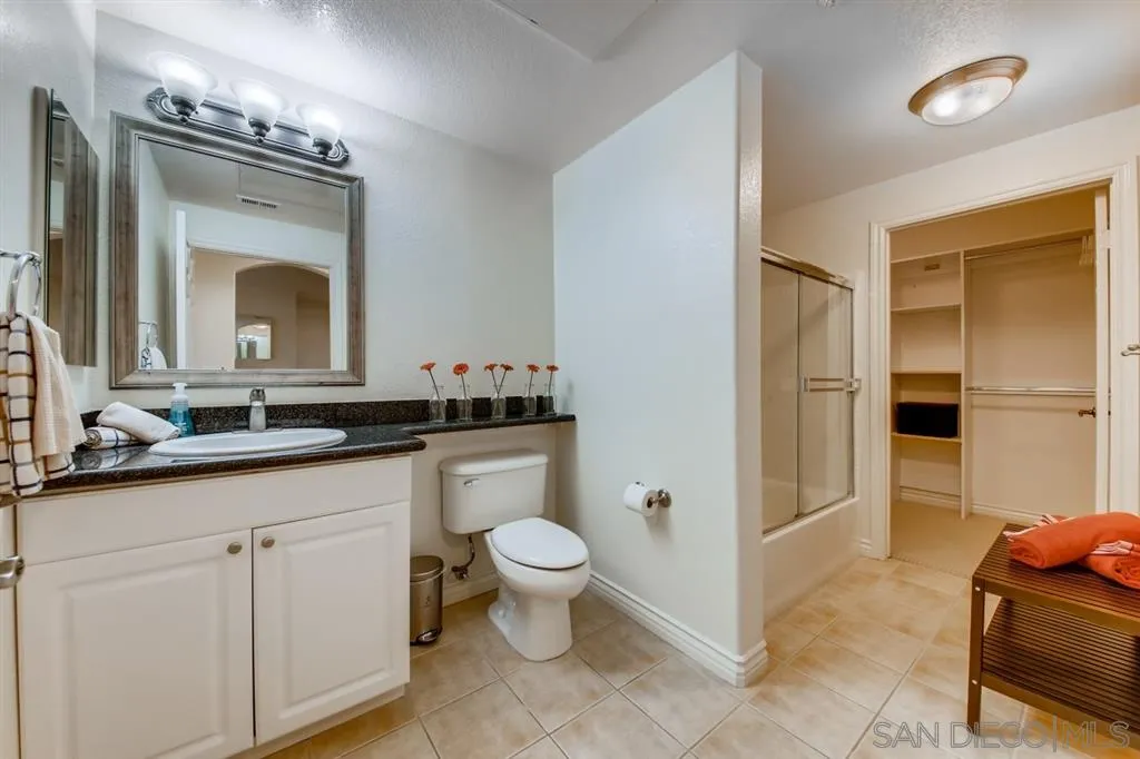 9263 Regents Road, Unit B203 La Jolla, CA 92037 - Photo 20 of 25 a bathroom with a toilet sink and shower