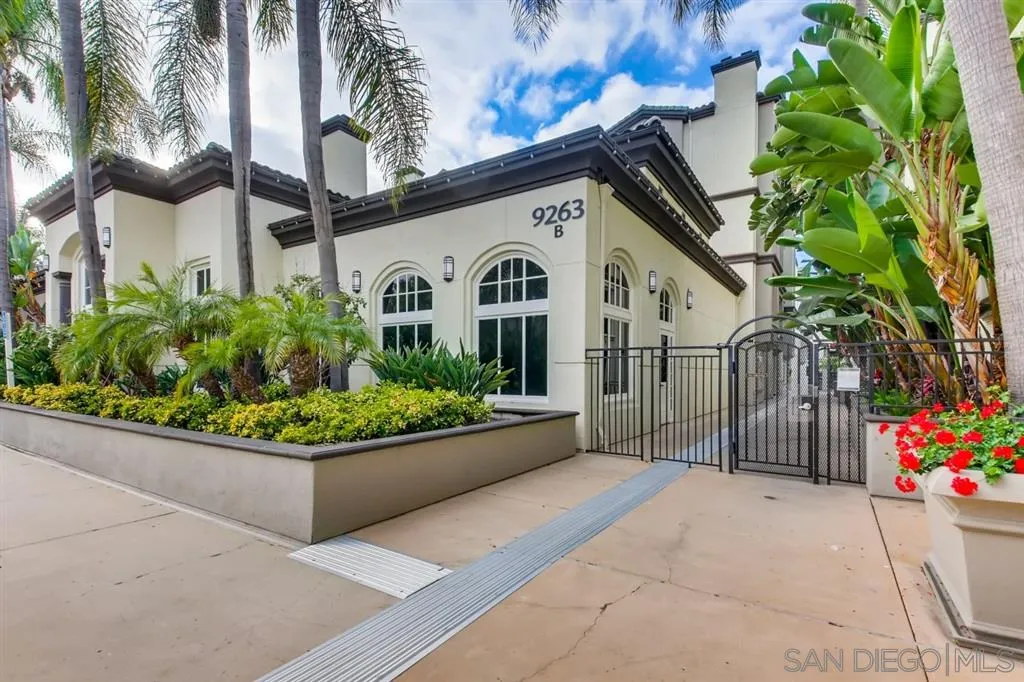 9263 Regents Road, Unit B203 La Jolla, CA 92037 - Photo 2 of 25 a front view of a house having yard