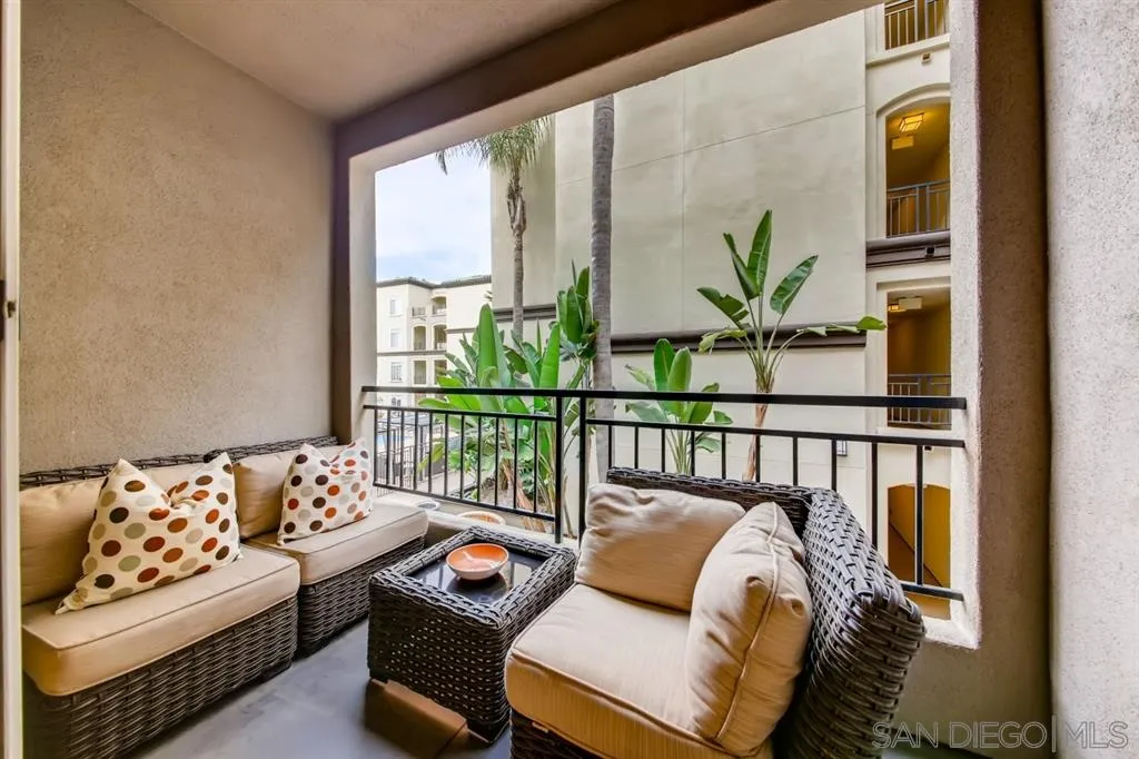9263 Regents Road, Unit B203 La Jolla, CA 92037 - Photo 21 of 25 a bedroom with furniture and a large window
