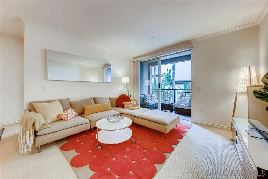 9263 Regents Road, Unit B203 La Jolla, CA 92037 - Photo 3 of 25 a living room with furniture and a window