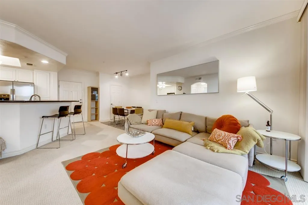 9263 Regents Road, Unit B203 La Jolla, CA 92037 - Photo 6 of 25 a living room with furniture and kitchen view