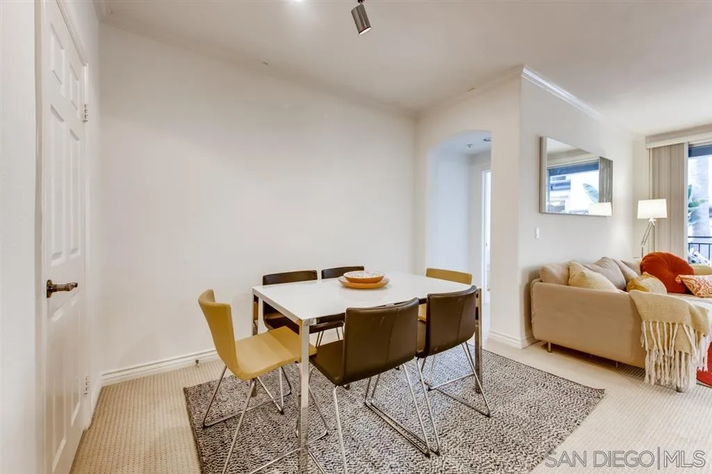 9263 Regents Road, Unit B203 La Jolla, CA 92037 - Photo 7 of 25 a living room with furniture and a table