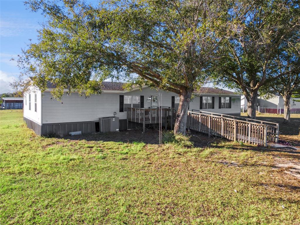 1477 Alford Road Haines City, FL 33844 - Photo 2 of 41 a view of a house with pool and sitting area