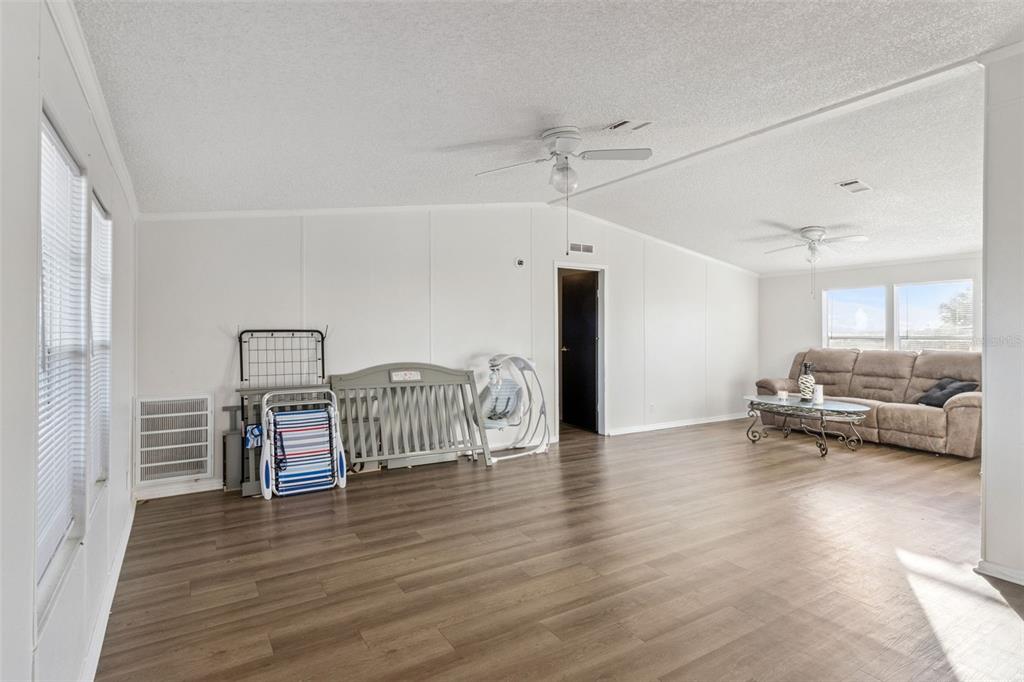 1477 Alford Road Haines City, FL 33844 - Photo 6 of 41 a view of livingroom with furniture and wooden floor