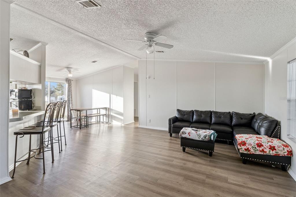 1477 Alford Road Haines City, FL 33844 - Photo 10 of 41 a living room with furniture and wooden floor