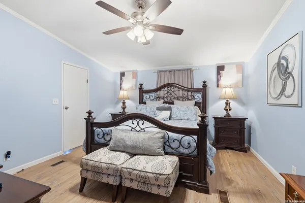 a bedroom with furniture and a chandelier
