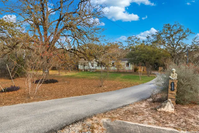 a view of a swimming pool with a yard