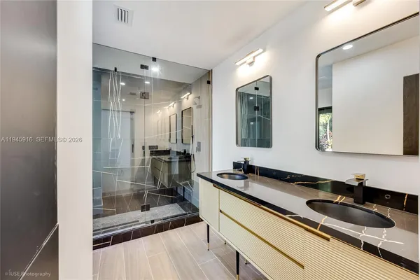 a bathroom with a sink and a mirror