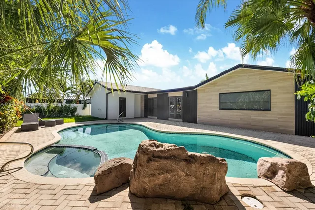 a backyard of a house with seating space