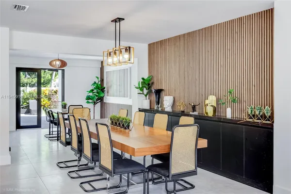 a view of a dining room with furniture window and outside view