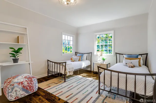 a bedroom with furniture and a window