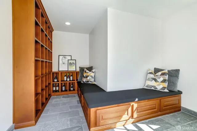 a view of an house with swimming pool and sitting area