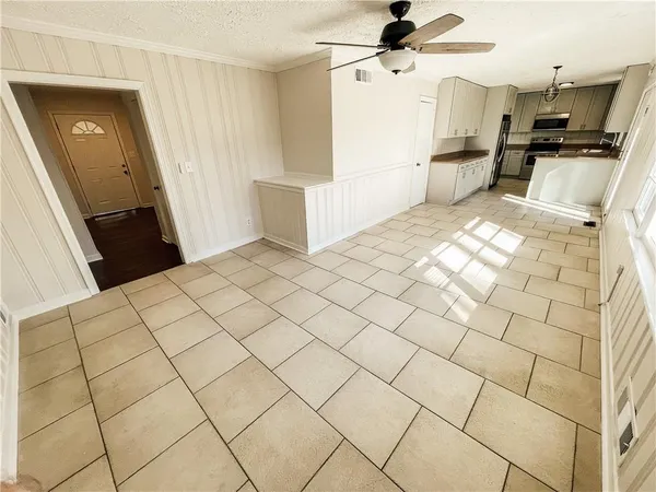 a view of kitchen with furniture and wooden floor