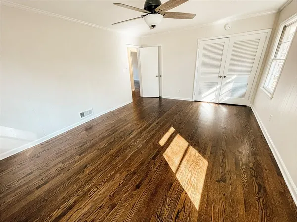 wooden floor in a hall with an entryway