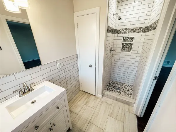 a bathroom with a sink and a mirror